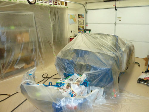 Plastic sheeting was used to mask off the car prior to spraying.