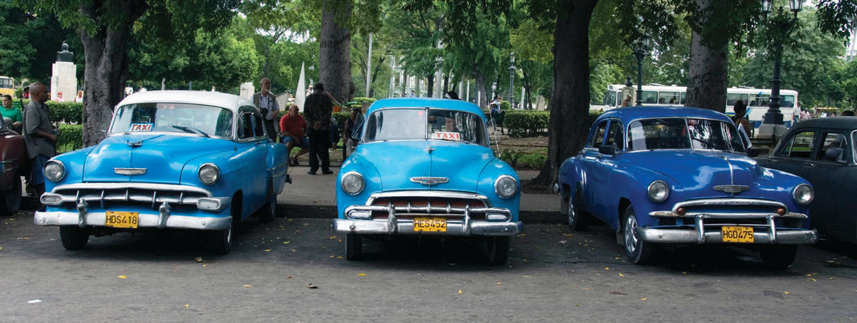 Chevrolets are still very popular in Cuba, as witnessed by this lineup. Left to right are a 1954, a 1952 and a 1950, all in livery service by the train station.