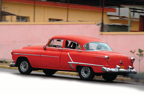 How can you tell that a legendary Rocket 88 V-8 no longer resides under the hood of this 1953 Oldsmobile? The black smoke pouring out of the tailpipe means it’s probably powered by a diesel tractor motor.