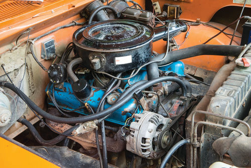 The amount of space under the hood means that sometimes the easiest way to work on the engine is to climb in and sit on an inner fender.