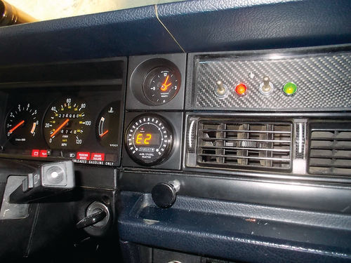 The Air/Fuel Ratio meter, choke knob, and fuel and vacuum switches in place on the dashboard.