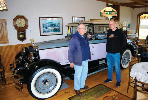 Dave Lindsay (left) started Josef off with a small taste of what was coming by showing him the 1926 Gardner roadster he displays in his living room.