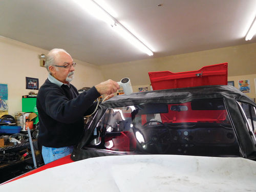 Ken uses a hair dryer to slightly warm the vinyl to expand it before making the final fit. As the vinyl cools it pulls the top fabric nice and tight.