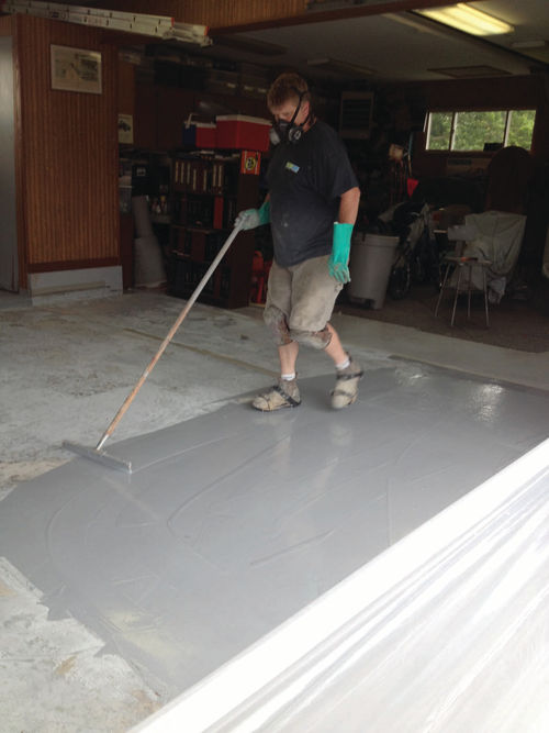 The second application of acrylic latex caulk. This fills low spots that remained after the first application. It was followed by the first coat of two-part epoxy paint.