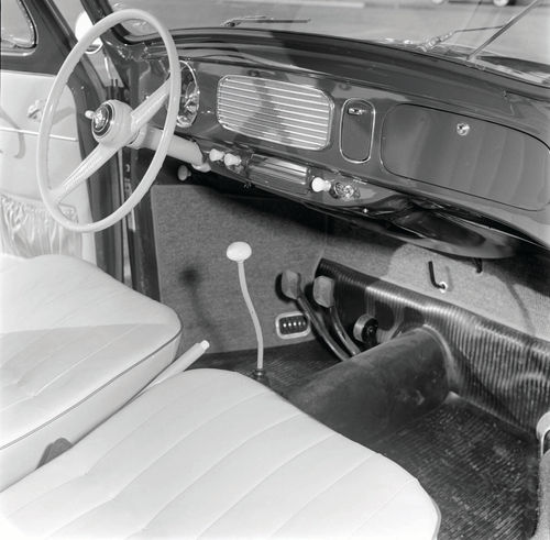 The 1956 Karmann Ghia interior featured front bucket seats and four-on-the-floor shifting. The dashboard was a simple affair.