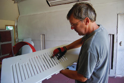 Body shop owner John Diermeier explains his approach to painting the louvered hood side panel.