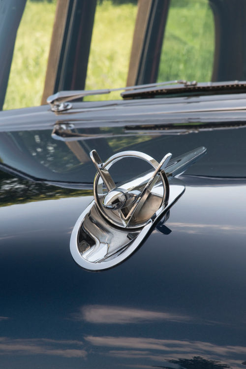 The bomb in the hood ornament gained a “V” in 1953 to commemorate the new V-8 under its hood.