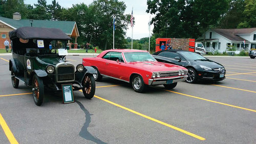 A half-century separates the Oakland from the SS Chevelle sitting next to it and there’s 100 years between it and the new convertible on the right.