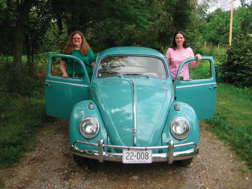 Sisters Gail and Susan with the restored 1962 Bug.