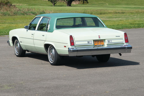 Seen from the rear, the Oldsmobile shows enough resemblance to a Cadillac to stump a casual observer.