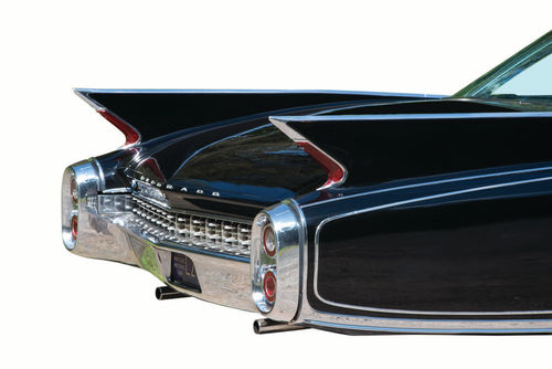 The bullet taillights of 1959 are gone, replaced by simple lenses following the contours of the fins. The new taillights allowed the fins to be flattened since there was no need for the stamping to match the bullets.