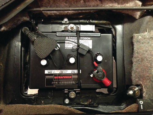 The original lead acid battery in the car’s battery box.