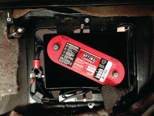 An Optima Red Top sealed 6-volt battery has been placed in the modified Group 2 bat - tery case.