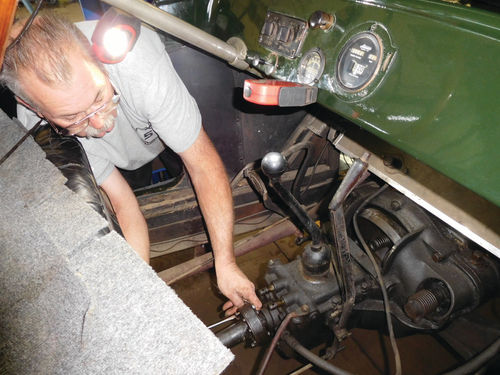 Ron Paige grabbed the propeller shaft and pulled it toward the rear of the car to split it from the U-joint assembly.