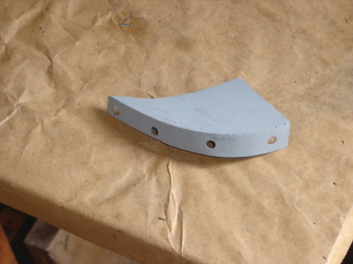 A replacement piece for the rot removed from the rear of the front wheel well.