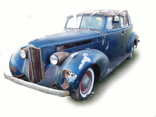 A 1940 Packard 120 four-door convertible brought $9250.