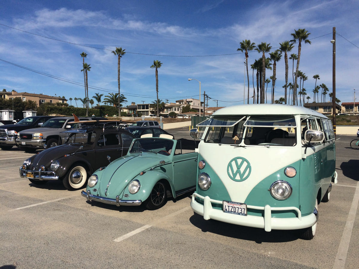 the black “Surf Bug,” the mint green “Beach Bug,” and the “Surfer’s Dream” Volkswagen bus, spotted in Seal Beach, California.