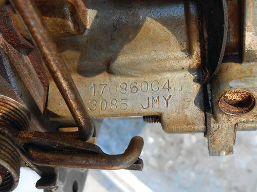 The carburetor number is located on the bowl above the throttle shaft on the linkage side.