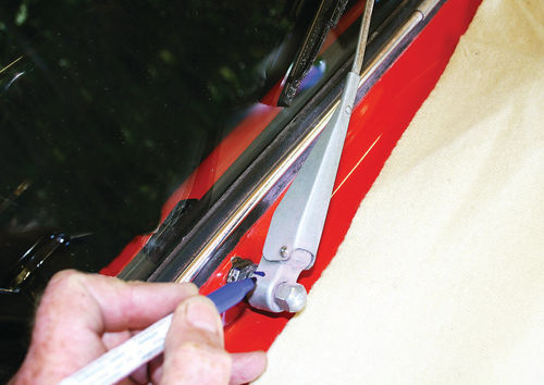 Mark your windshield wiper arms in relation to their stanchions before removing them.