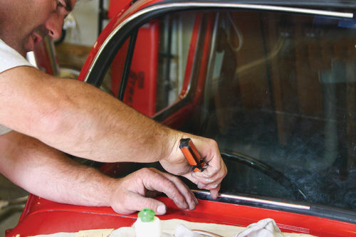 Carefully install brightwork molding using a screwdriver or filler spreader.