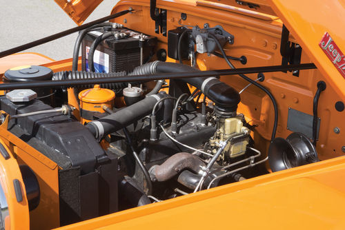 The four is a tight squeeze in the engine bay. Between the support rods and the hood, access is tight.