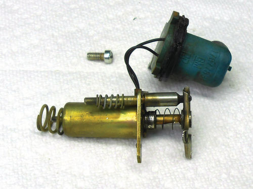 This is the mixture control solenoid with its plunger and lean mixture adjustment screw.