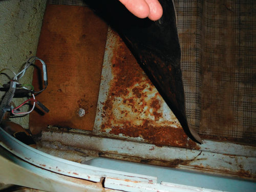 In addition to allowing the trunk mat to get damp and dirty, the lack of a complete trunk seal on the Fairlane promoted some serious rusting of the trunk floor pan.