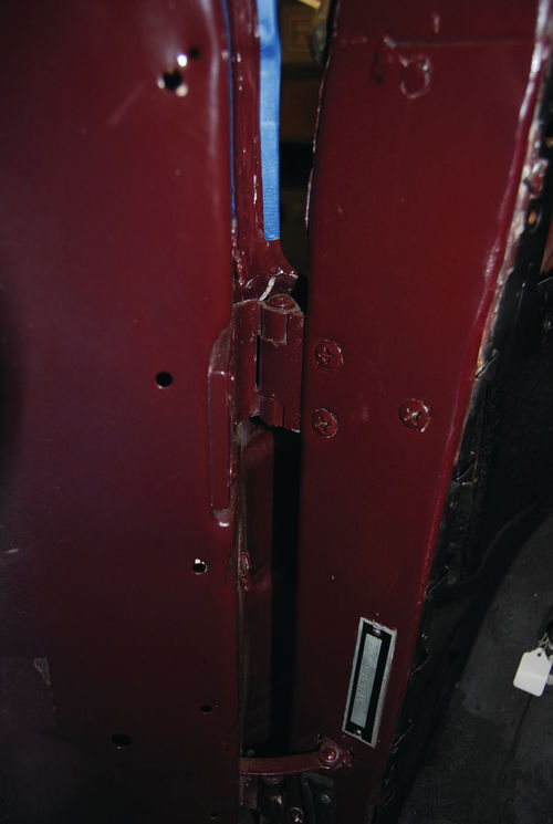 A difficult area to seal is the body pillar-door hinge location. The blue tape shows how far the rubber door seal comes down. Below that there is no rubber seal.