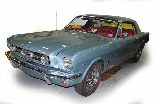 Even ’60s cars like this Mustang may tend to leak more with age. Note the cardboard placed under the sporty Ford to catch the leaks and drips from seals and gaskets.