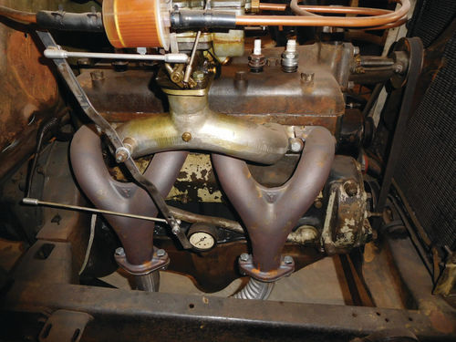 As this Model A “hot rod” engine illustrates, there are lots of spots where oil can leak onto the outside of an engine. If it gets on the exhaust, it can become burnt carbon and stink.