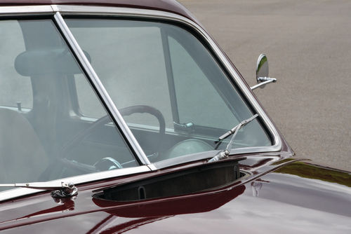 A split windshield and pop-up vent were still standard at this point in time.