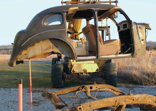 Fortunately, the forklift’s undersized forks stayed on their wooden extensions.