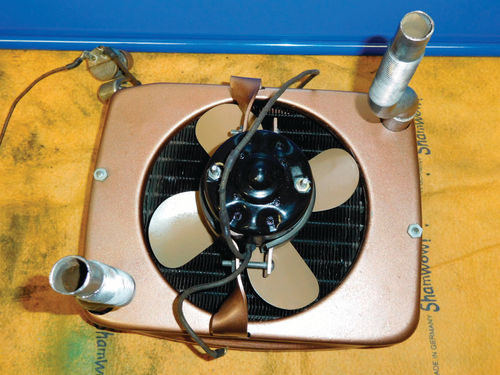 A bird’s-eye view of the rear of the heater. Note the nuts on the long screws in the 3 o’clock and 9 o’clock positions. These hold the housing halves.