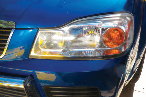 After scuffing and buffing, this Saturn headlight lens is as good as new.