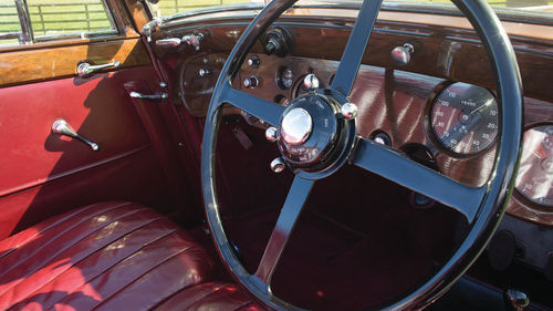 The woodgrain dash gleams like a component in a new car.