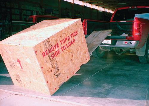 I used a wooden ramp to push the empty 206-pound crate into my pickup box.