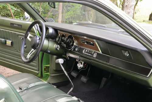 Woodgrain and plated plastic date the dashboard’s look. Its layout and functionality, though, are fine even by today’s standards.