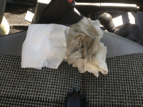 After allowing the Tracker to air out for several hours in the hot sun with the windows down, the interior was cleaned to remove the mold. Comparing wipes shows how much mold was removed with the disinfectant.