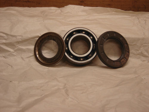 Nilos ring (left) used to seal front bearings (center) vs. rubber lip seal (right) used on rear.