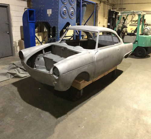 The body shell of the little car after media blasting.