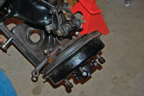 An MG TD brake drum is of the type with studs on the hub that pass through holes in the drum.