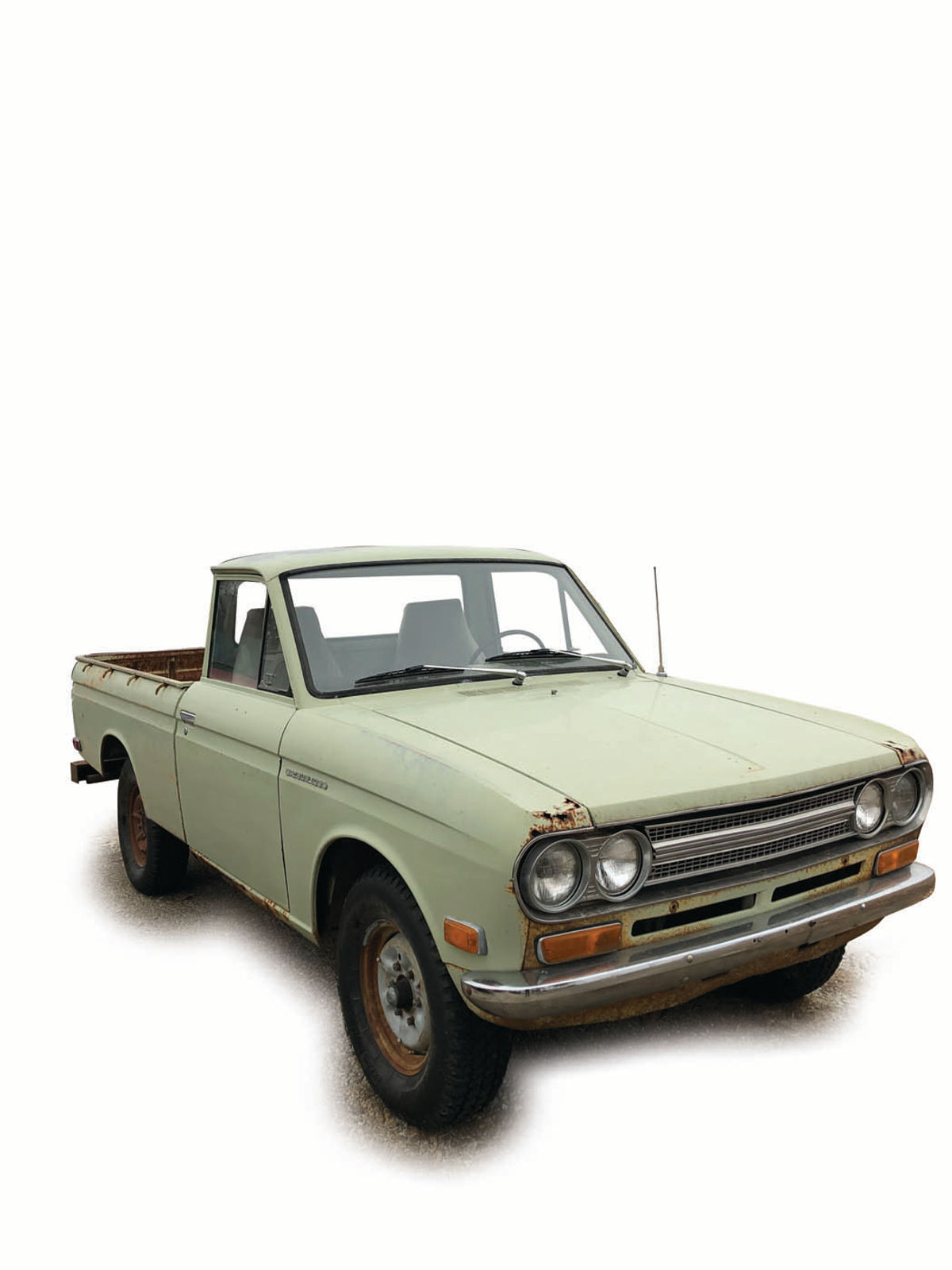 Note the original mint green color of this 1971 Datsun Pickup. It is rare to see original paint colors on classic vehicles in a climate that experiences severe weather.