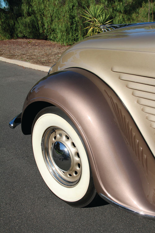 The brown fenders provide a nice accent for the metallic golden beige exterior.