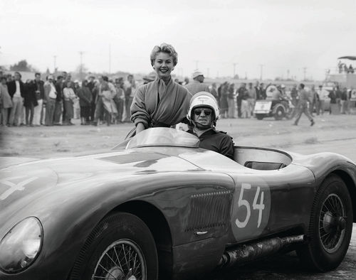 Since a young woman is perched on the side of the car, we’re assuming the “lost C-Type” must have been victorious that day at the track.