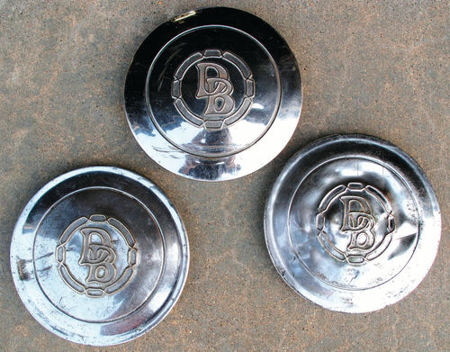 Although they’re still scratched and dented, these three hubcaps just look nicer after polishing.