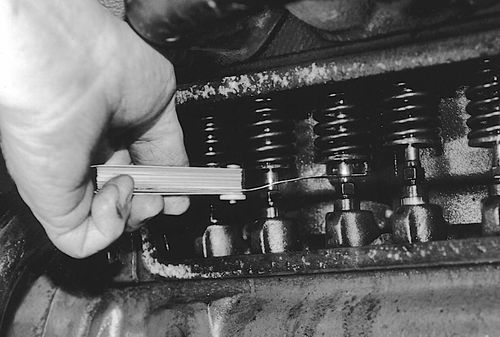 Use a feeler gauge to adjust the clearances. I like to set exhaust valves one thousandth over to prevent burned valves later.