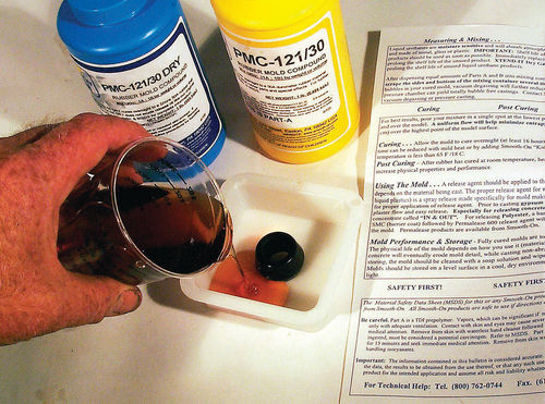 Pour the mold-making compound into the mold dam slowly to minimize air bubbles.