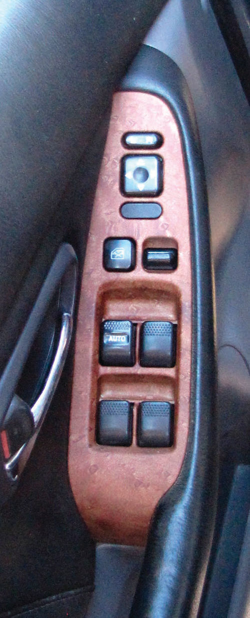 This shows the center trim stack and a door-mounted switch panel after hydrographic treatment.