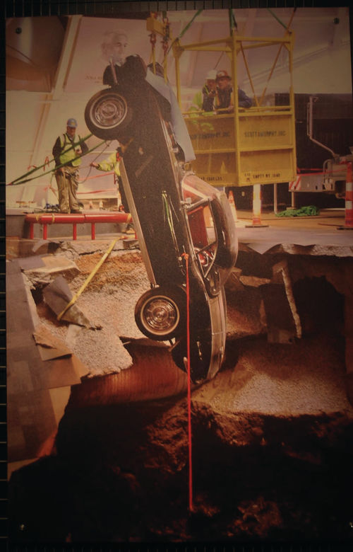 A crane lifted the ’62 Corvette from the sinkhole after the floor collapsed. On Feb. 9, 2017 the black ’62 Corvette was pushed into the restoration area.