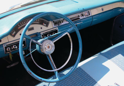 The foot-long speedometer is shaded by an eyebrow arch in the dash.